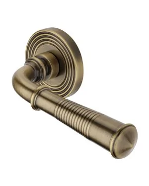 Heritage Brass Door Handle Lever Latch on Round Rose Bridgetown Reeded Design Antique Brass finishUK Registered Design Number 6226297