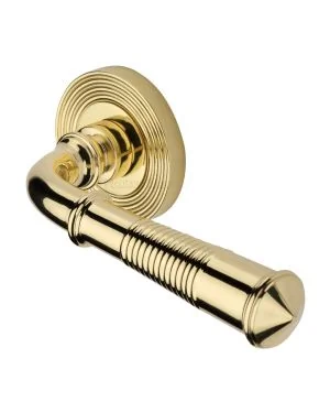 Heritage Brass Door Handle Lever Latch on Round Rose Bridgetown Reeded Design Polished Brass finishUK Registered Design Number 6226297